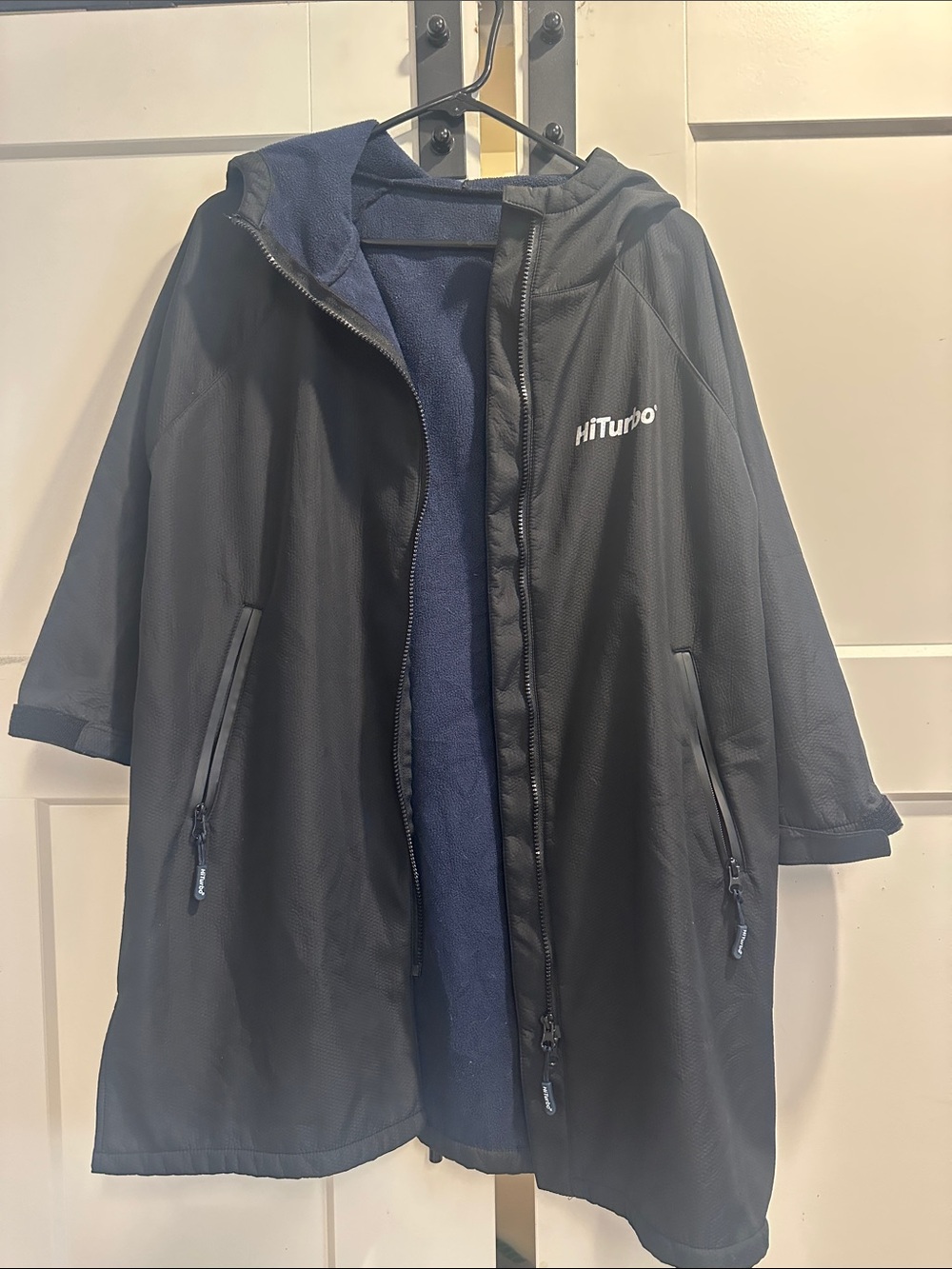 Black youth, swim jacket.